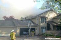 A ladder raised above a garage area