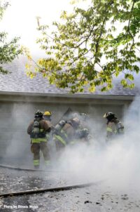 Firefighters surrounded in smoke