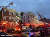 An assortment of Boston fire trucks battling the fire