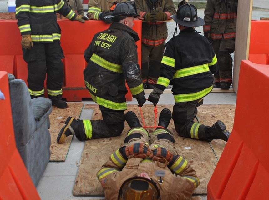 Two firefighters dragged a down firefighter during training