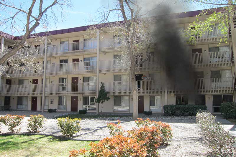 Smoke arises from a garden apartment