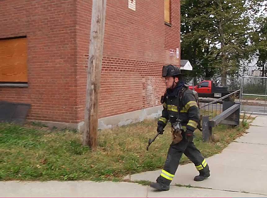 Outside vent firefighter goes around to the C side of the building