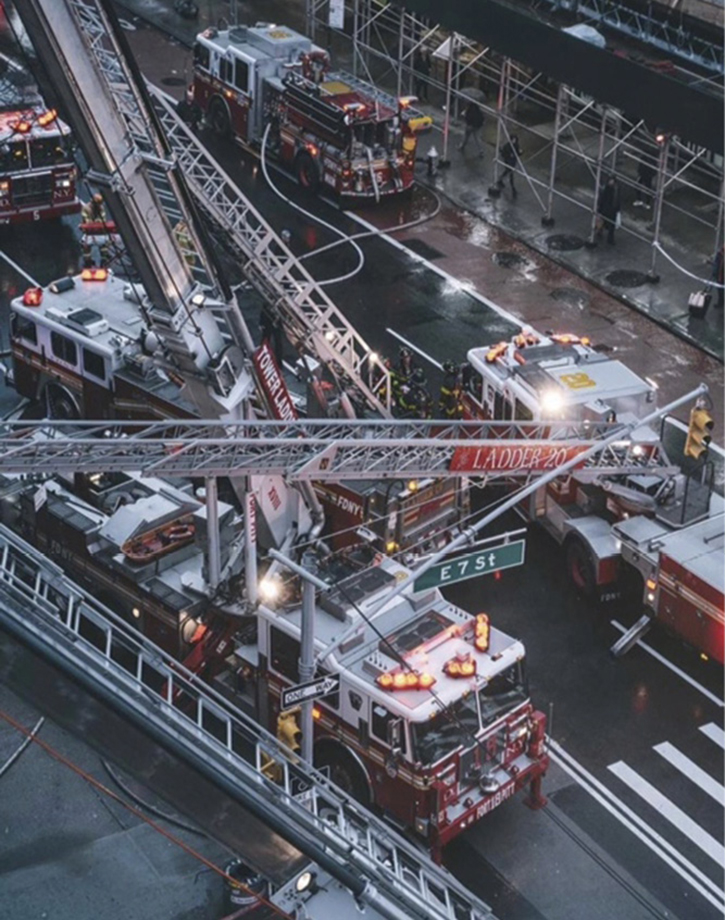 Three aerials—one tiller and two tower ladders—operated at this scene and were used for ventilation, access, egress, and hose stretching.