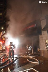 Firefighters mask up outside pharmacy