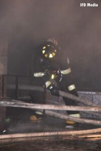 Firefighter working at scene of fire