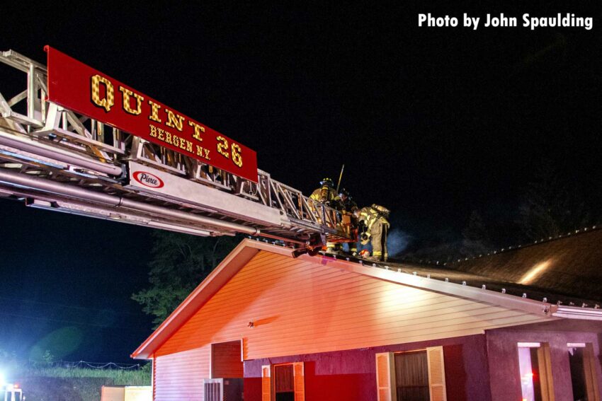 Aerial ladder extended to the fire building