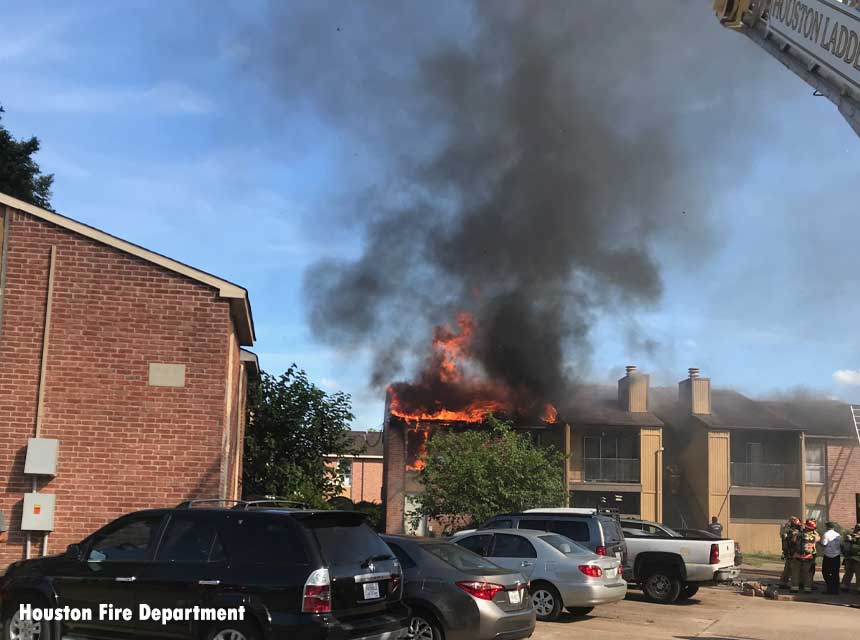 Flames shooting from a Houston apartment fire