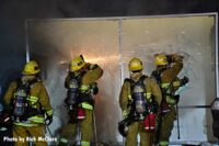 Los Angeles firefighters using saws to force entry