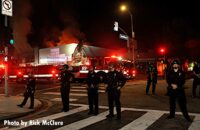 Los Angeles police guard trucks and fire scene