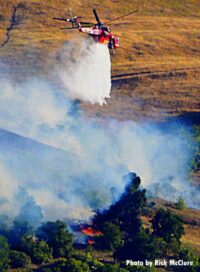 Helicopter with smoke from Lime Fire