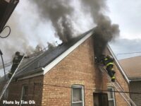 Chicago firefighters work at the scene of a house fire