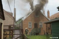 Smoke drifts from a burning home in Chicago