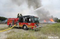 Fire truck with master stream on outdoors fire