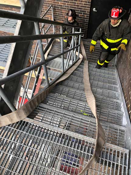 Flaking a hose up stairs