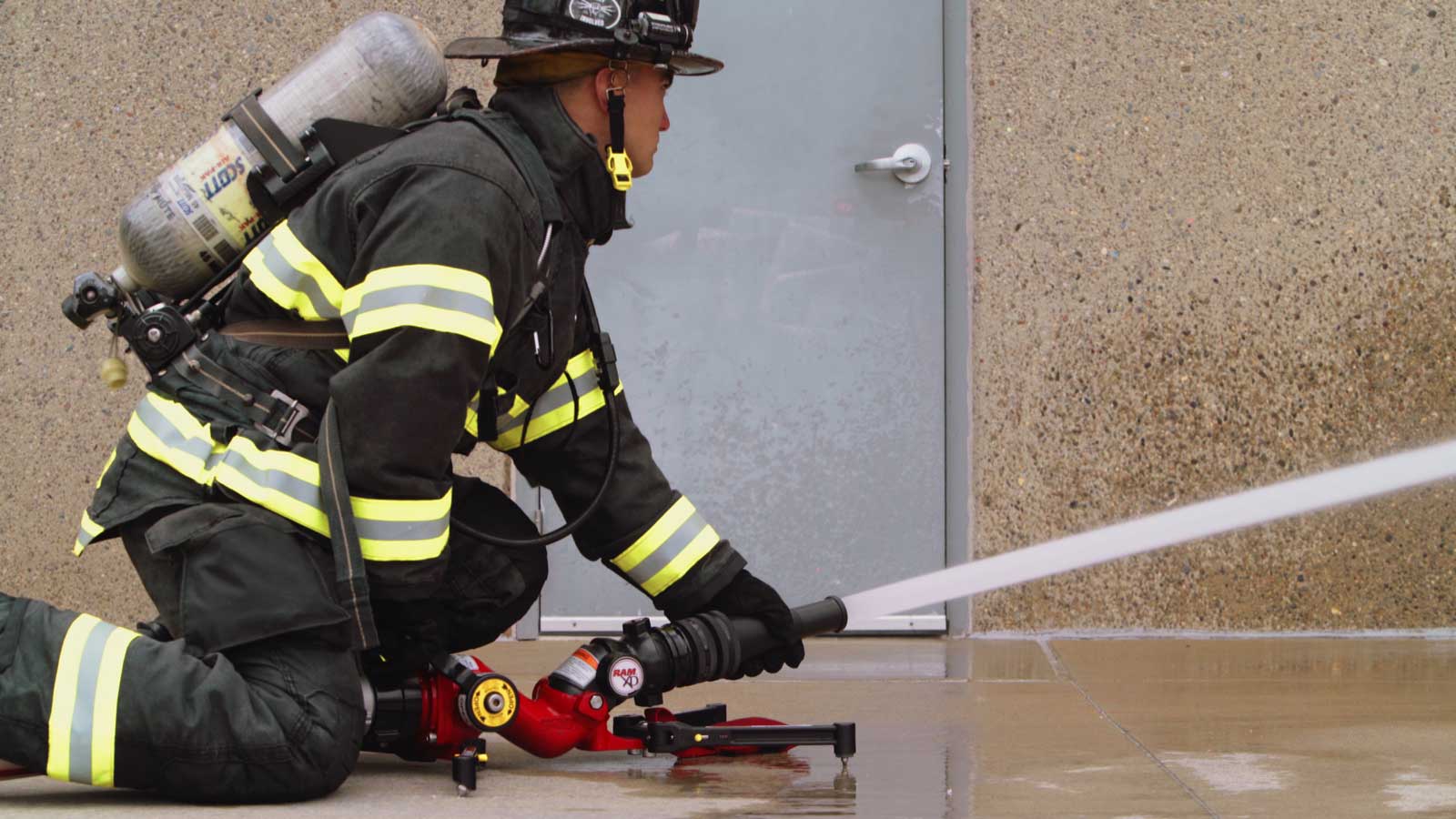 Firefighter using a portable ground monitor