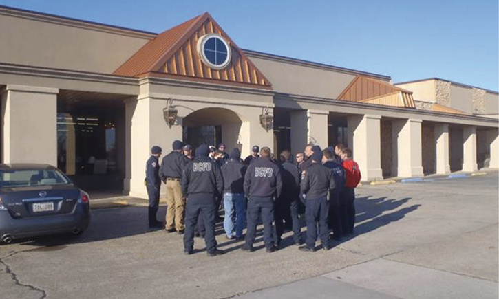 Firefighters preplanning a converted commercial target hazard in their first-due area. Originally a movie theater, this structure is now a furniture showroom and warehouse.