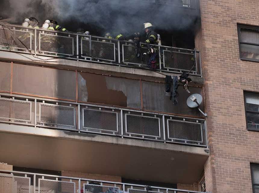 FDNY firefighters work at a high-rise fire