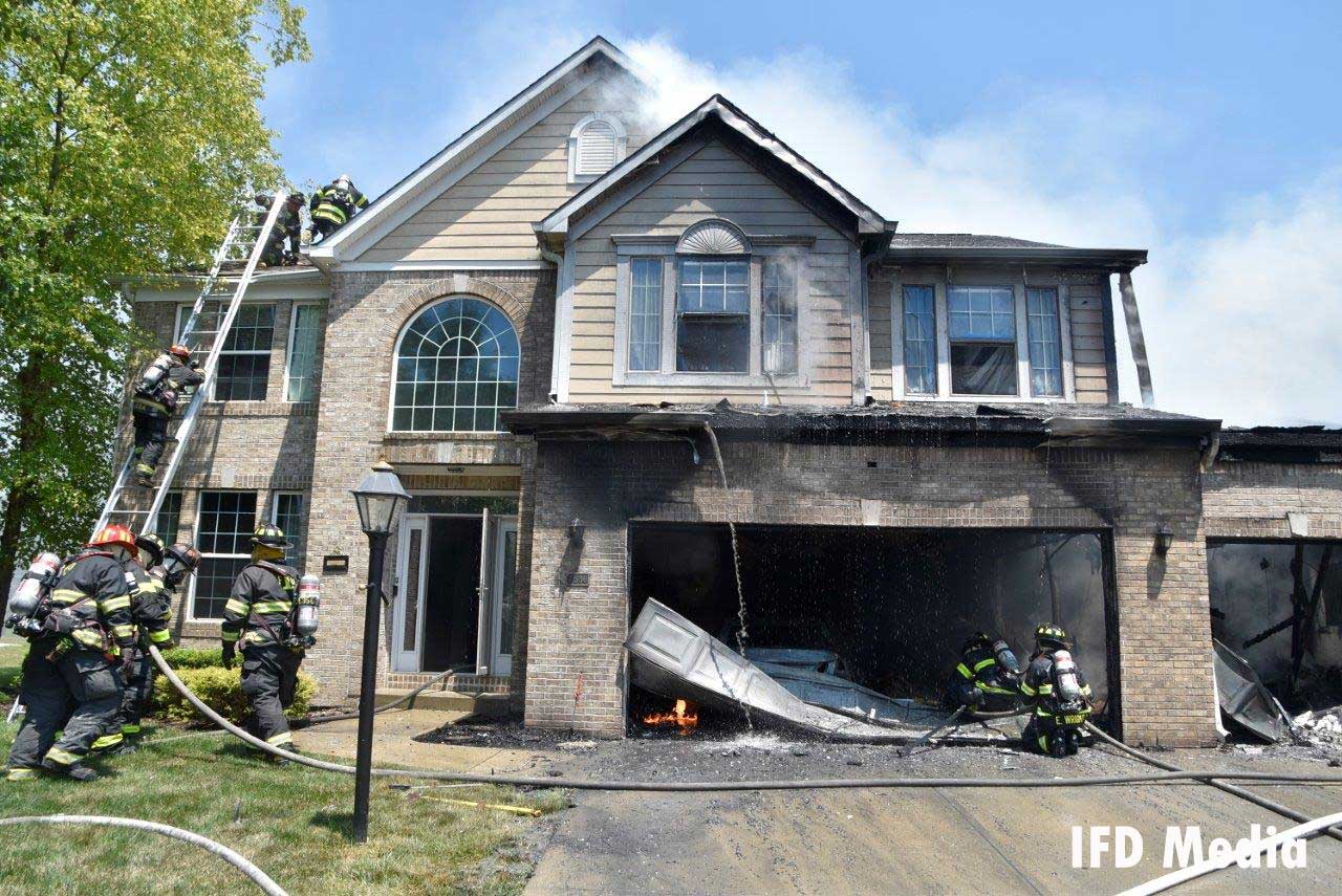 Indy firefighters operating a house fire