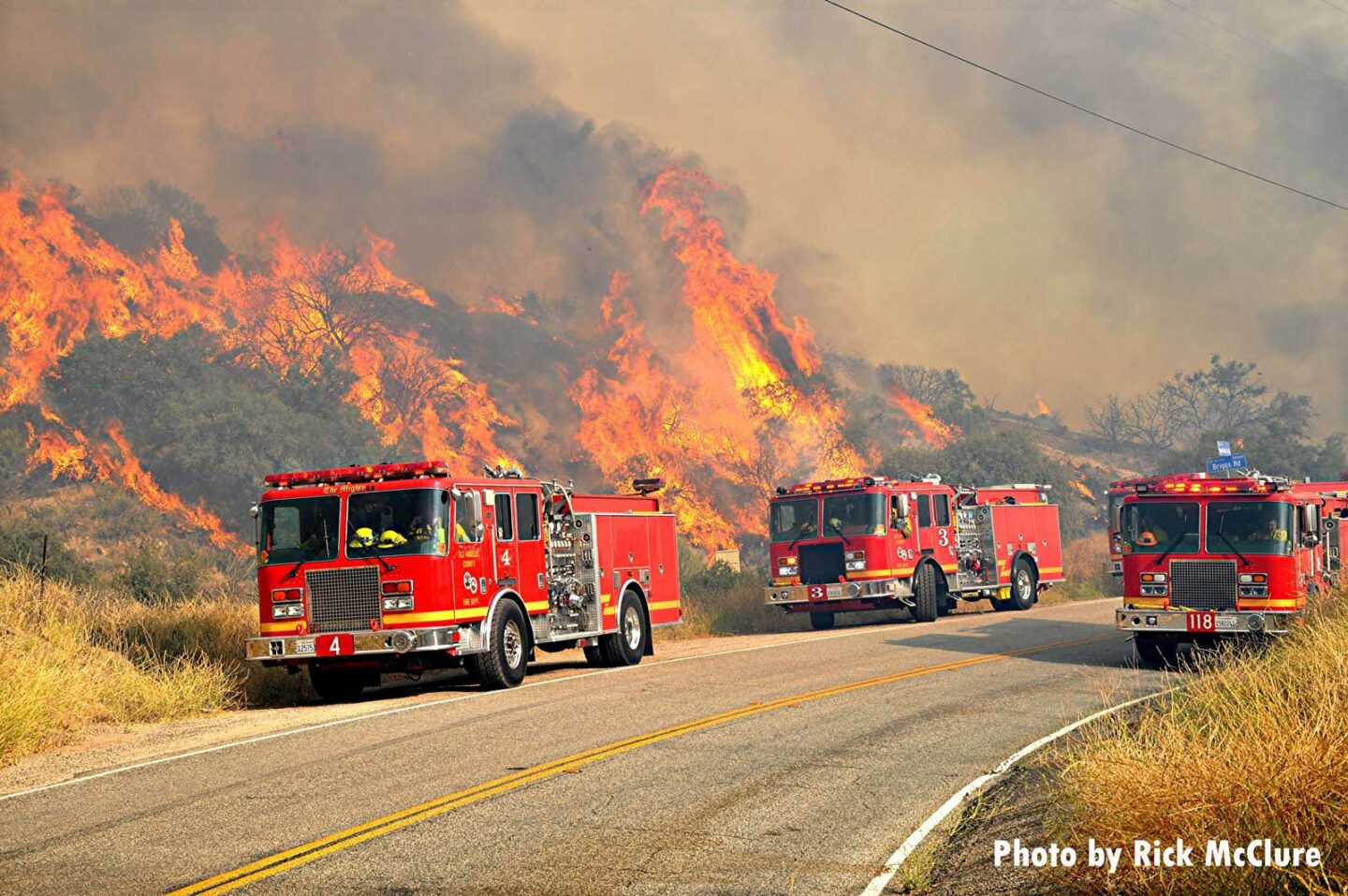 Fire trucks near wildland fire in California