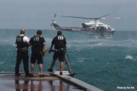 Chicago fire officials with helicopter in background