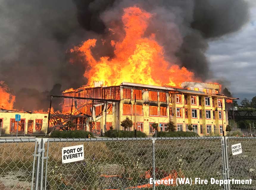 Flames rage through apartment fire under construction