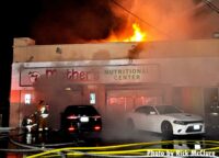 Fire rages in a large building in Los Angeles