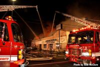 Aerial master streams put water on the fire building