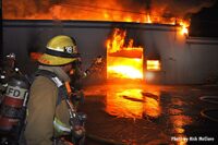 Firefighter working at commercial structure in Los Angeles