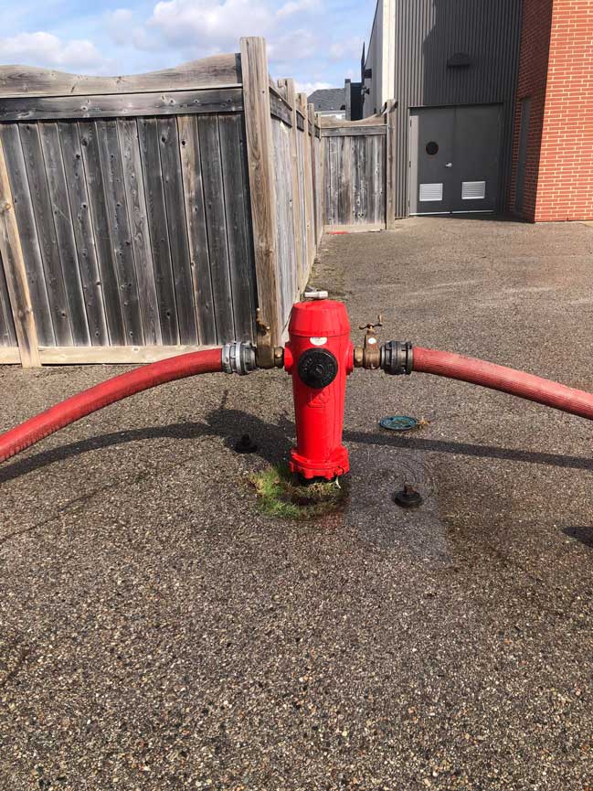 Fire hydrant with two hoses connected