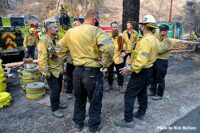 Firefighters confer during Lake Fire in California