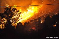 Flames streak through brush and woods