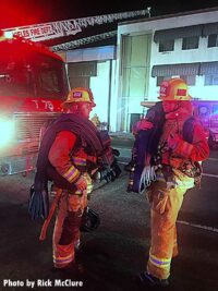 Two Los Angeles firefighters at the fire