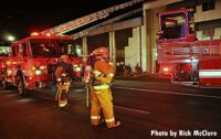 LAFD fire trucks and firefighters at the fire scene