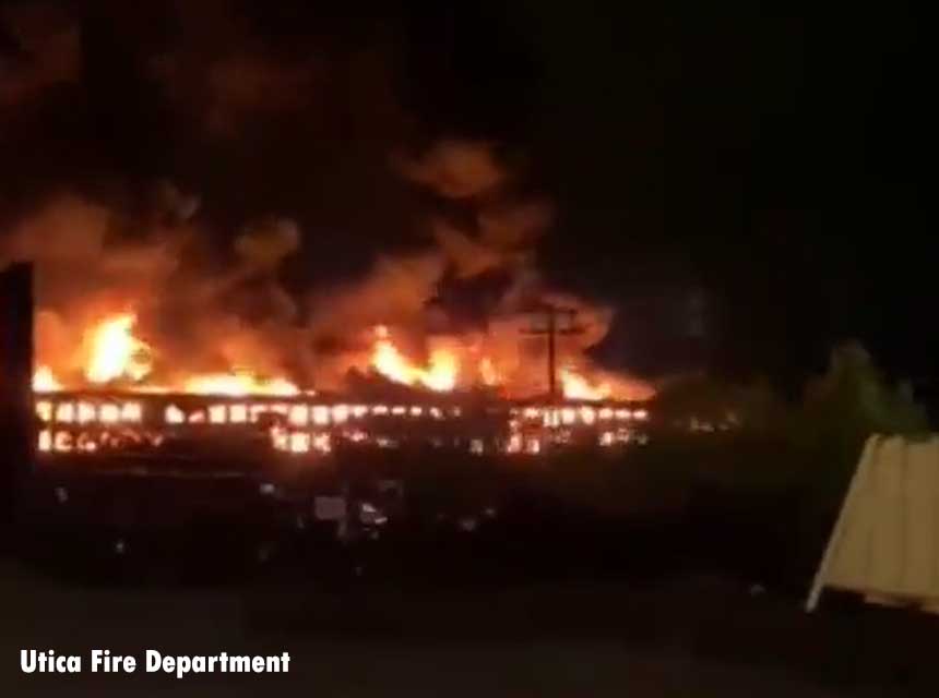 Flames shoot from abandoned mall in Utica