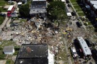 Debris and rubble covers the ground