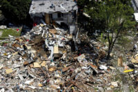 Debris and rubble covers the ground