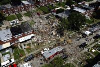 Debris and rubble covers the ground