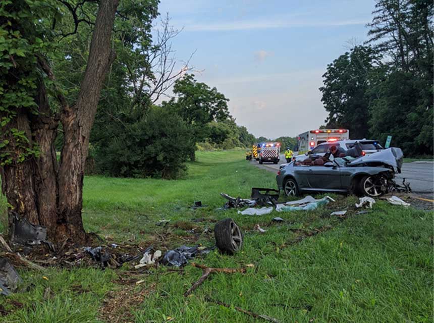 Wrecked car at scene of highway crash