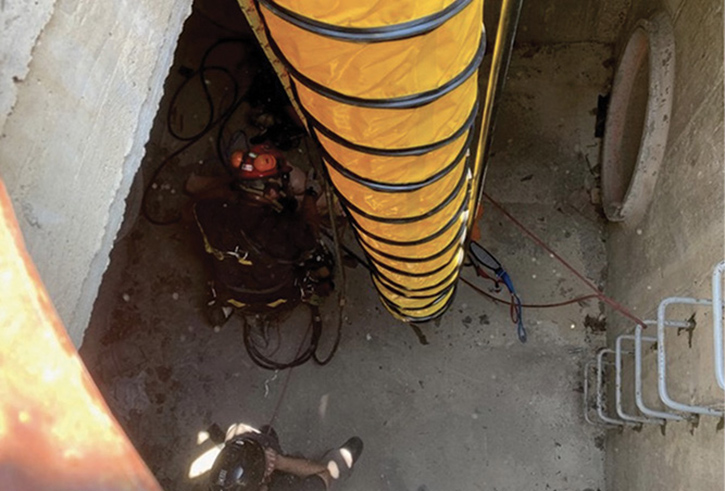 Members of MABAS Division 1 Technical Rescue Team perform ventilation of a confined space during an NFPA 1670 Confined Space Technician course delivered by Elevated Safety at the Northeastern Illinois Public Safety Training Academy in June 2020.