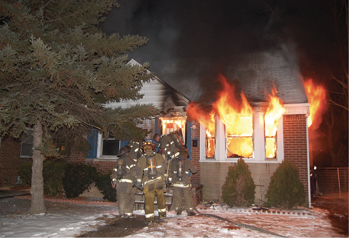 There is likely to be a good amount of searchable space within this structure. The fire will not take a time out while searches are being made. Having an attack team suppress the fire and support the search effort is of greatest benefit in this scenario given the staffing available.