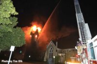 Aerial water stream trained on church fire