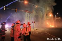 Command with burning church in background