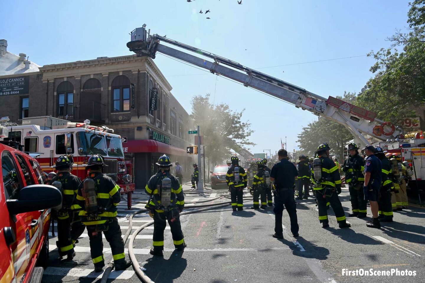 Firefighters and a tower ladder at a fire in NYC