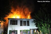 Flames rip through the roof of the residential structure