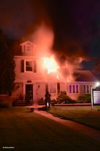 Flames shoot from a home in the village of Hempstead, New York