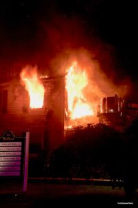 Fire shoots from multiple windows of the building