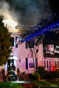 Aerial device in use at structure fire