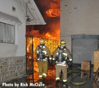 Firefighters see flames raging between the walls