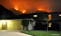 Bobcat Fire raging behind a structure