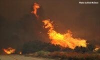 Flames burn over the landscape